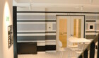 Picture of a table and door way from the Common Rooms into the Chemistry Room